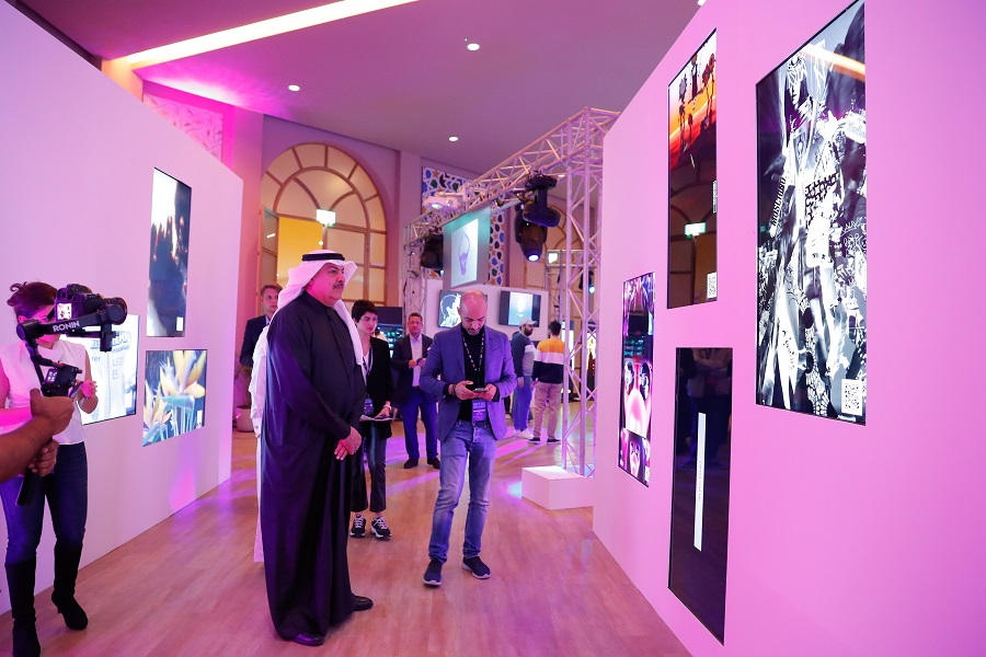 NFT Art pieces with pink lighting background at NFT MENA EXHIBIT 2022